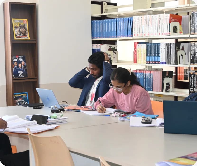 Students working together at a library study table