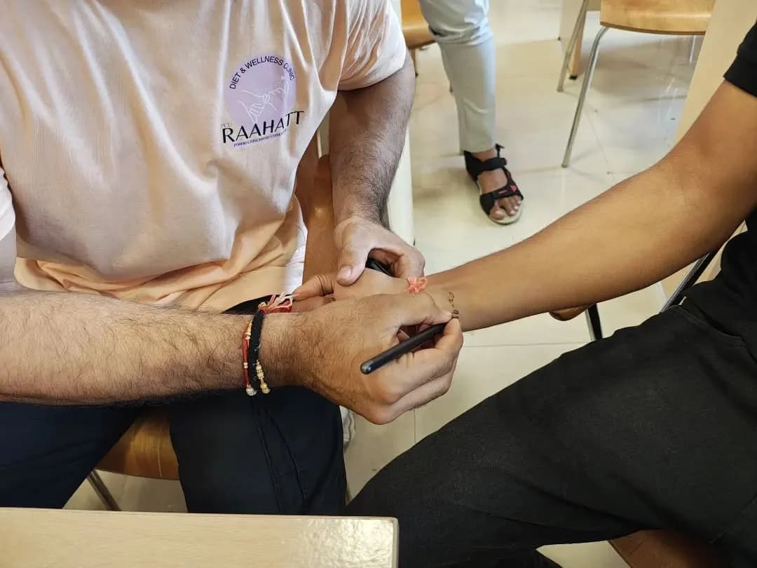 Hands-on clinical wellness activity at Raahatt