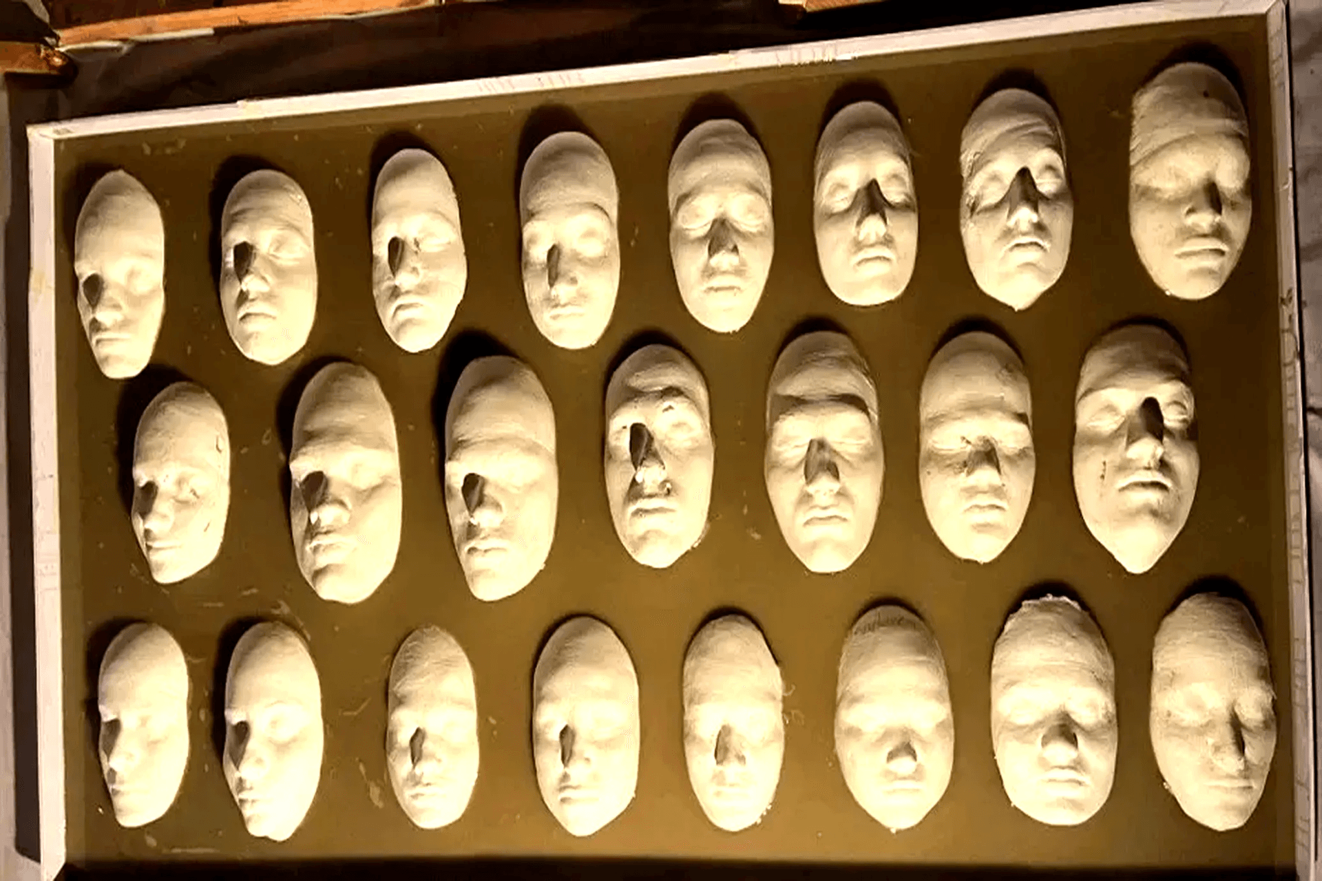 Plaster mask display in the design studio