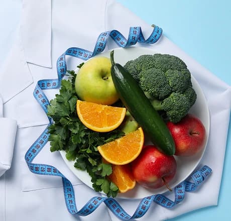 Nutrition and dietetics still life with fresh produce and measuring tape