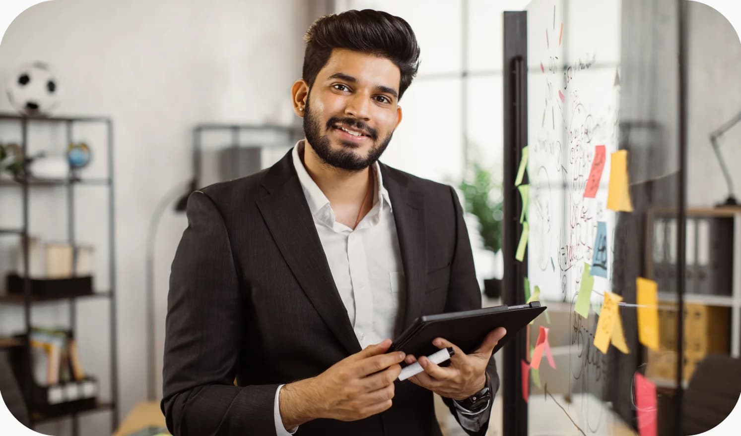 R&D engineer reviewing technical data on a tablet in an innovation workspace