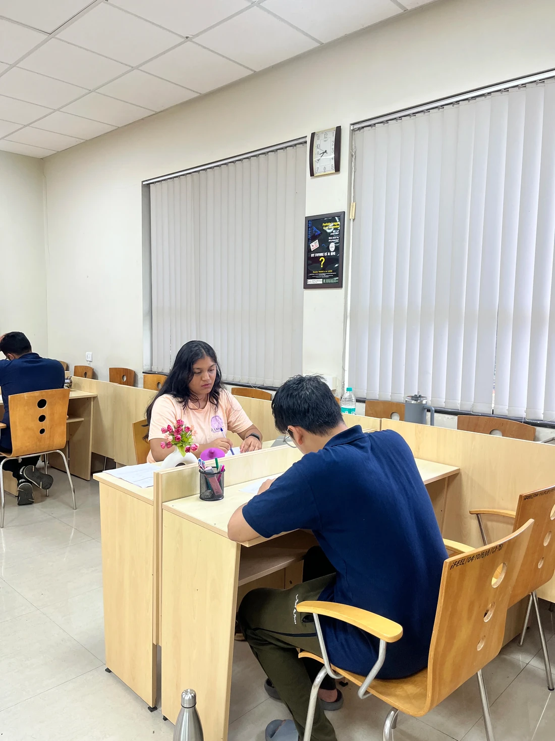 Ph.D. scholars studying in research carrels at PCU